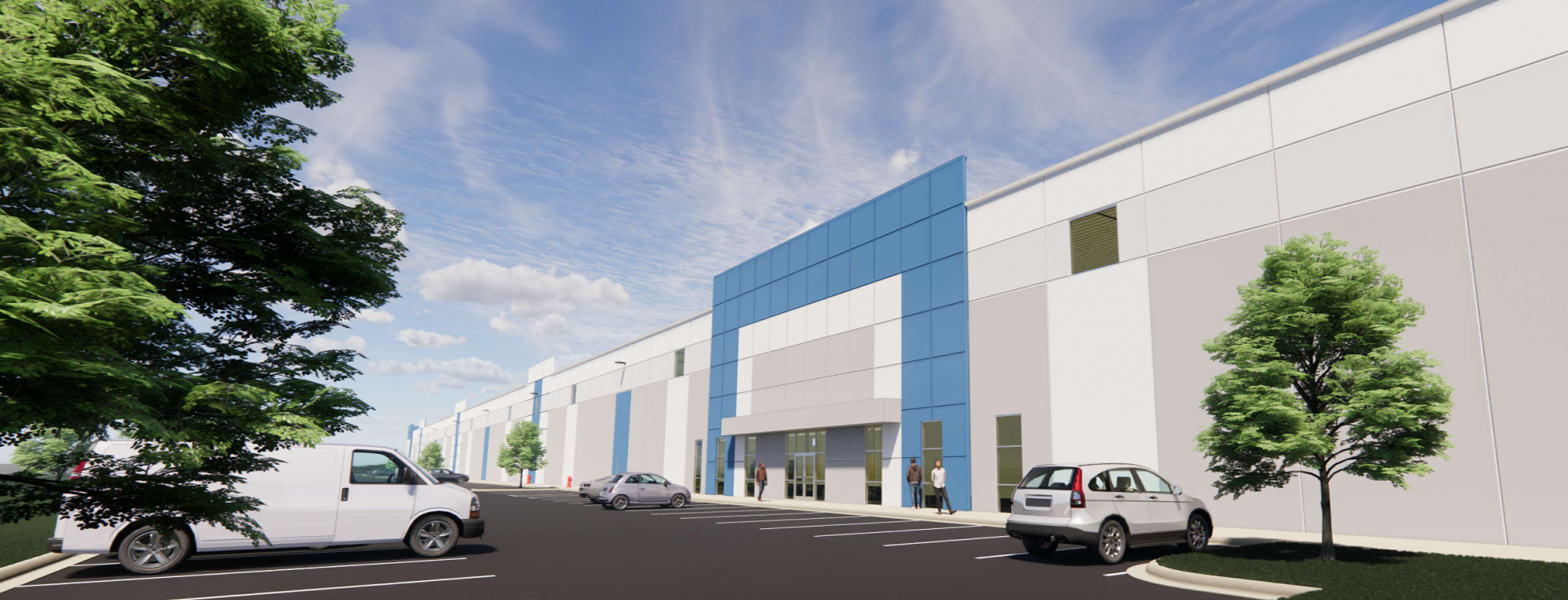 A modern commercial building with a blue and white facade, large windows near the entrance, several parked cars in front, and green trees on both sides under a partly cloudy sky.