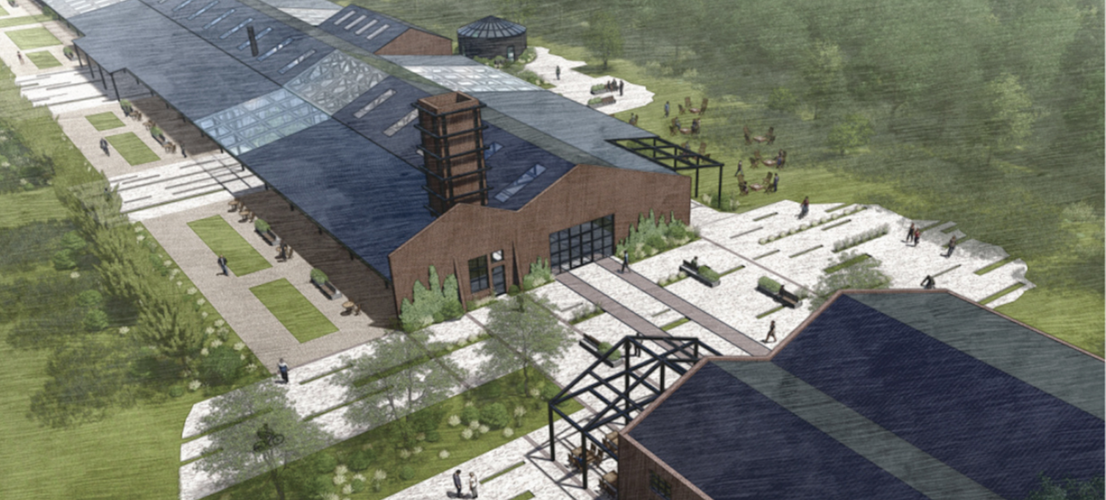 Aerial view of a modern industrial-style complex with large glass roofs, brick buildings, landscaped pathways, greenery, and people walking around the site.