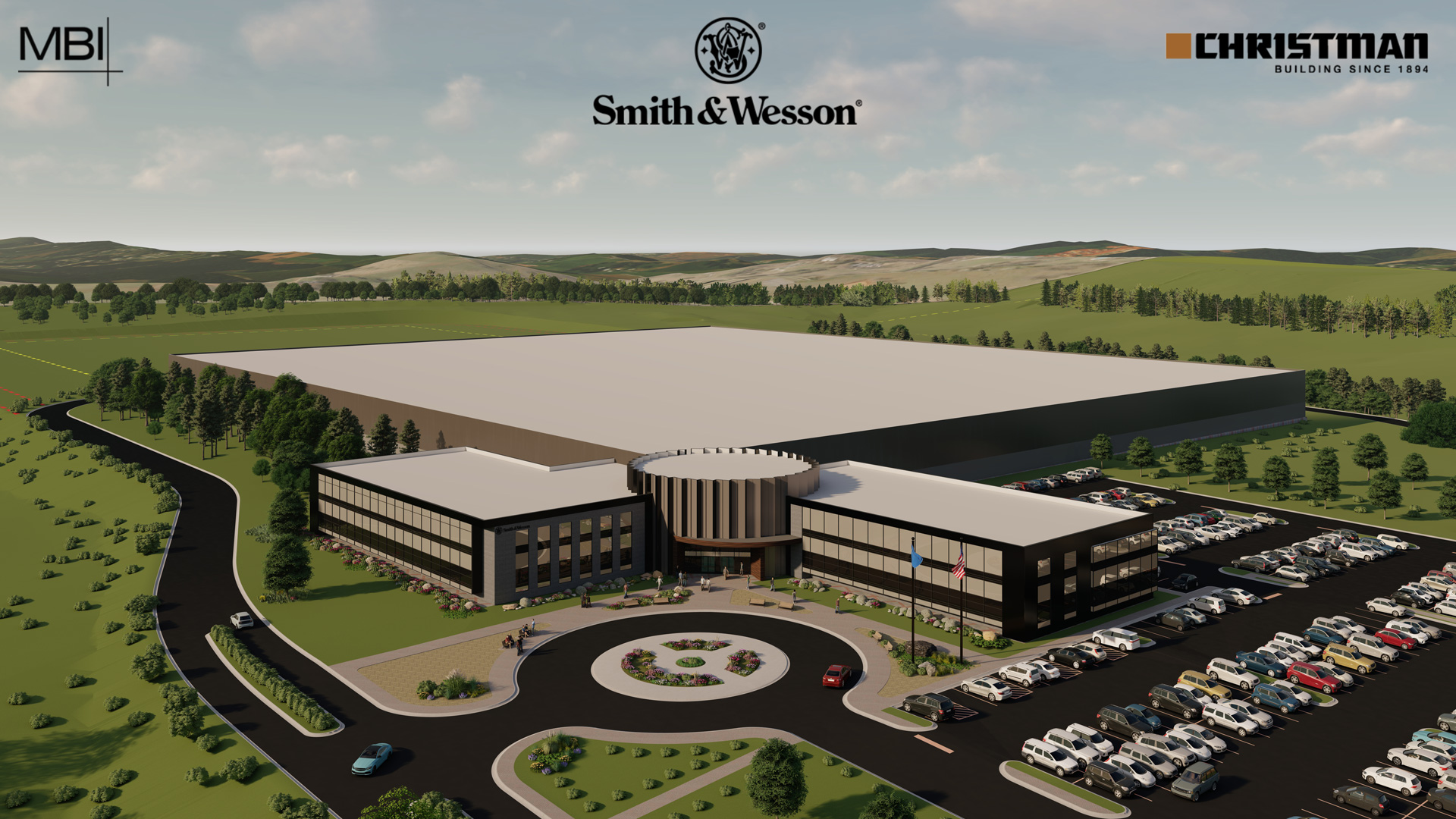 Aerial rendering of a large industrial building surrounded by parking lots and greenery, with Smith & Wesson, Christman, and MBI logos at the top. Cars fill the parking lots, and the landscape is open and spacious.