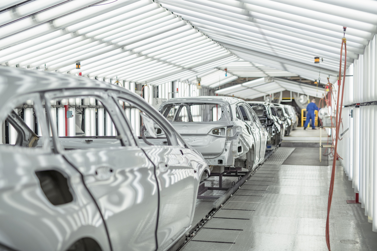 Car bodies in paint inspection area in car factory