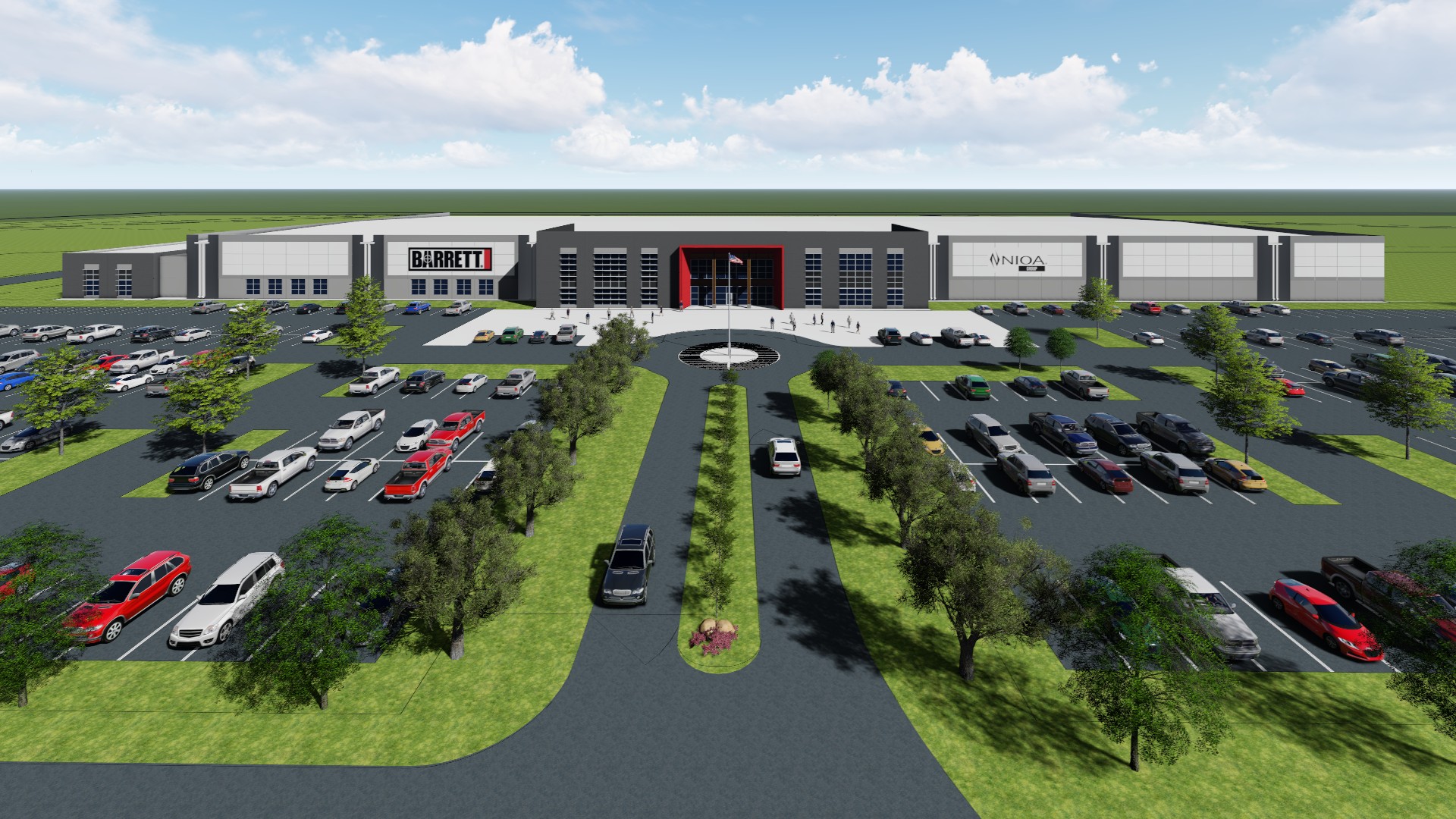 An aerial view of a modern building with signs reading "Barrett" and "FMD&A," a circular driveway with a roundabout, numerous parked cars, landscaped trees, and a large parking lot under a blue sky.