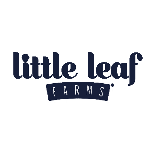The image shows the logo of "Little Leaf Farms" with the words "little leaf" in a bold, playful font and "FARMS" in uppercase letters on a curved banner below. The design is in dark blue on a light background.